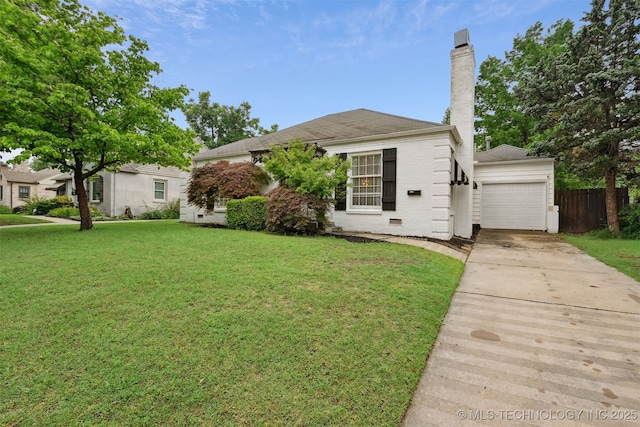3510 E 21st Pl, Tulsa, OK 74114 - view of front of house with an attached garage, driveway, a chimney, and brick siding