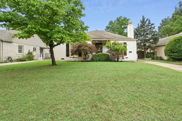 3510 E 21st Pl, Tulsa, OK 74114 - view of property hidden behind natural elements with a chimney, a front lawn, and crawl space