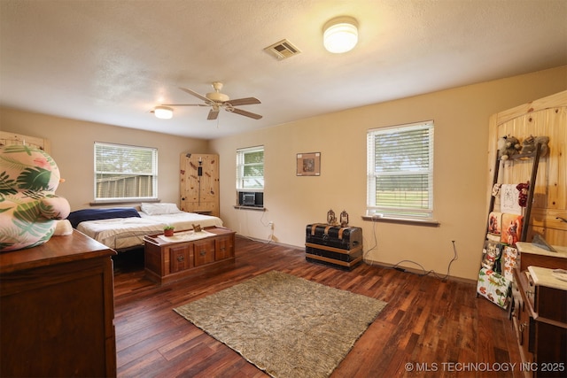 2984 Church Rd, Mead, OK 73449 - bedroom featuring dark wood finished floors, cooling unit, and a ceiling fan