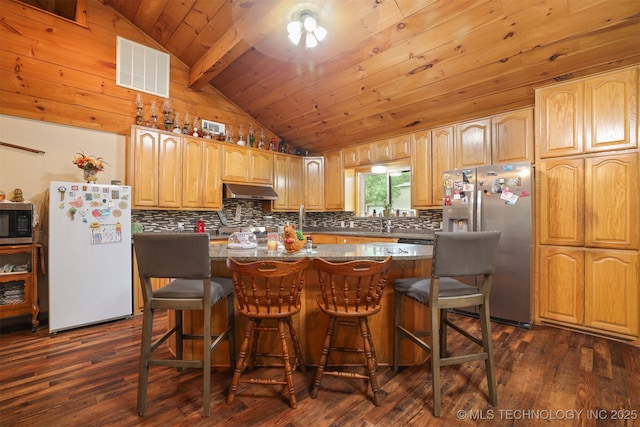 2984 Church Rd, Mead, OK 73449 - kitchen with stainless steel appliances, decorative backsplash, dark wood-style floors, and wooden ceiling