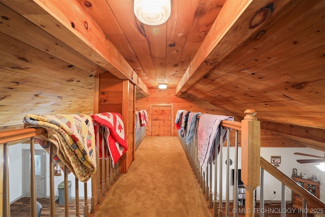2984 Church Rd, Mead, OK 73449 - hall featuring wood ceiling, an upstairs landing, wooden walls, and carpet floors