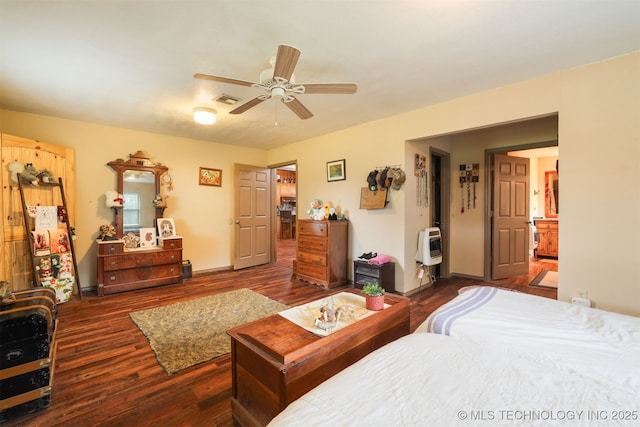 2984 Church Rd, Mead, OK 73449 - bedroom featuring wood finished floors, heating unit, and a ceiling fan
