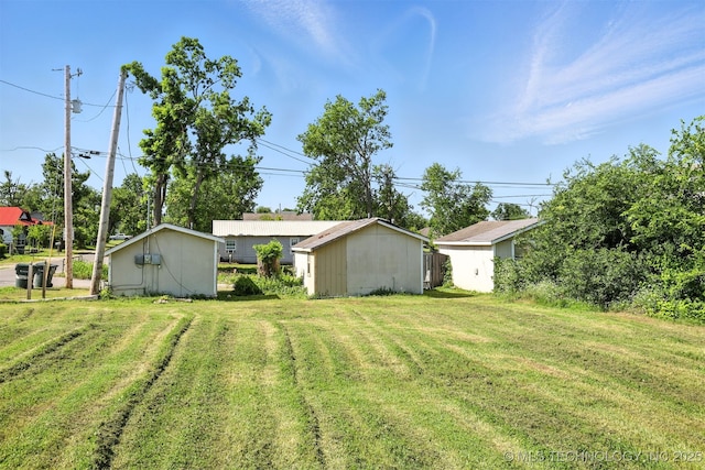 211 W Jordan St, Claremore, OK 74017 - view of green lawn featuring an outbuilding