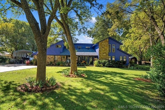 25206 E 64th St, Broken Arrow, OK 74012 - view of front facade featuring a detached carport, a front yard, and stone siding