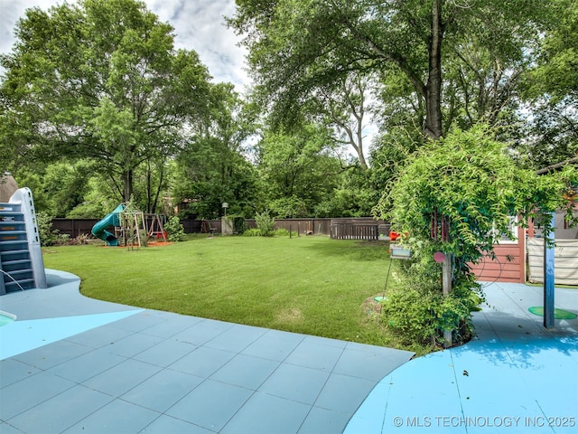 25206 E 64th St, Broken Arrow, OK 74012 - view of yard featuring a playground, a patio, and view of scattered trees