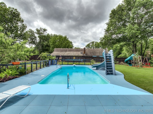 25206 E 64th St, Broken Arrow, OK 74012 - view of swimming pool featuring a water slide and view of wooded area