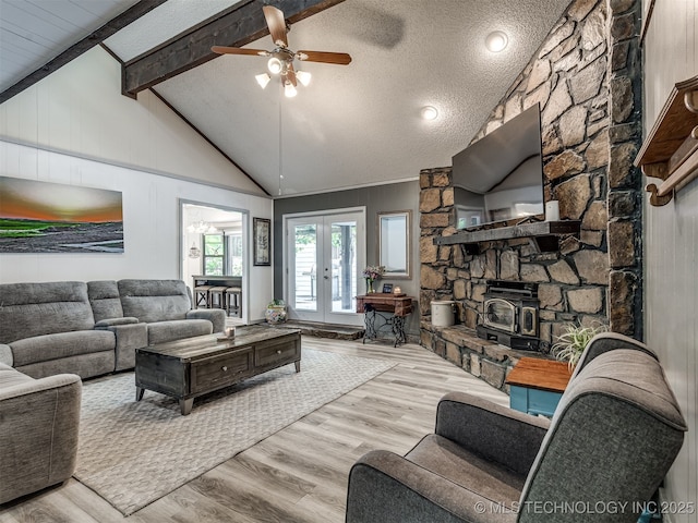 25206 E 64th St, Broken Arrow, OK 74012 - living room with wood finished floors, a ceiling fan, french doors, and a textured ceiling