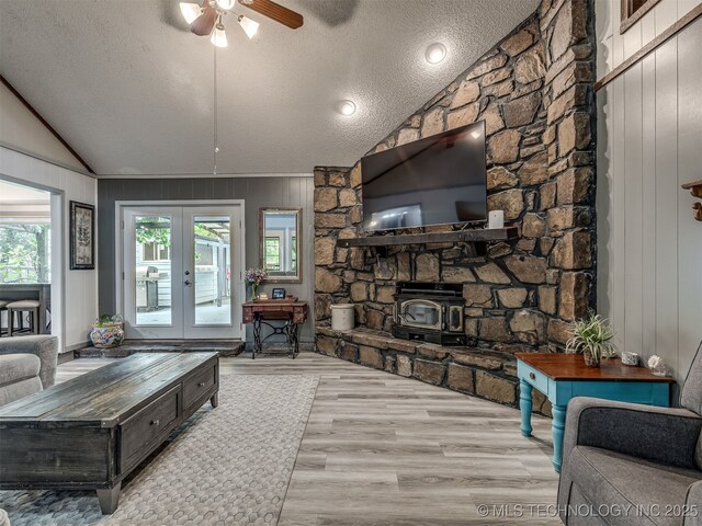25206 E 64th St, Broken Arrow, OK 74012 - living area with vaulted ceiling, a textured ceiling, ceiling fan, wood finished floors, and french doors