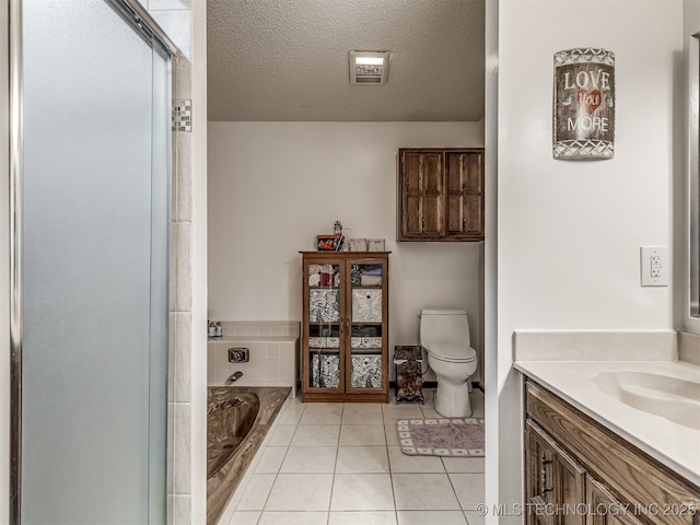 25206 E 64th St, Broken Arrow, OK 74012 - bathroom featuring vanity, a garden tub, toilet, a shower stall, and a textured ceiling