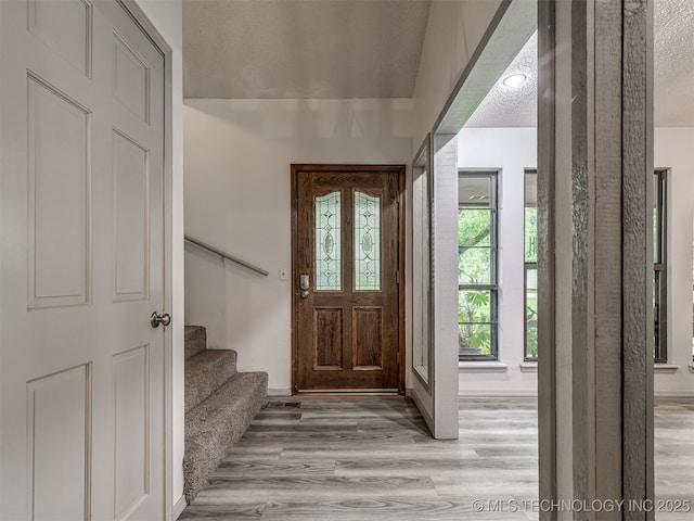 25206 E 64th St, Broken Arrow, OK 74012 - foyer featuring light wood finished floors and stairs