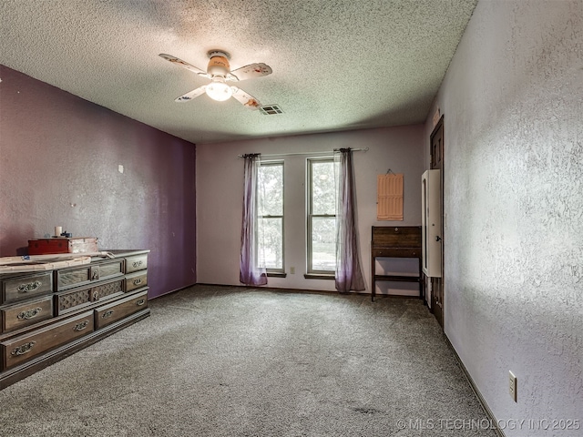 25206 E 64th St, Broken Arrow, OK 74012 - carpeted spare room featuring a textured wall, a textured ceiling, and ceiling fan