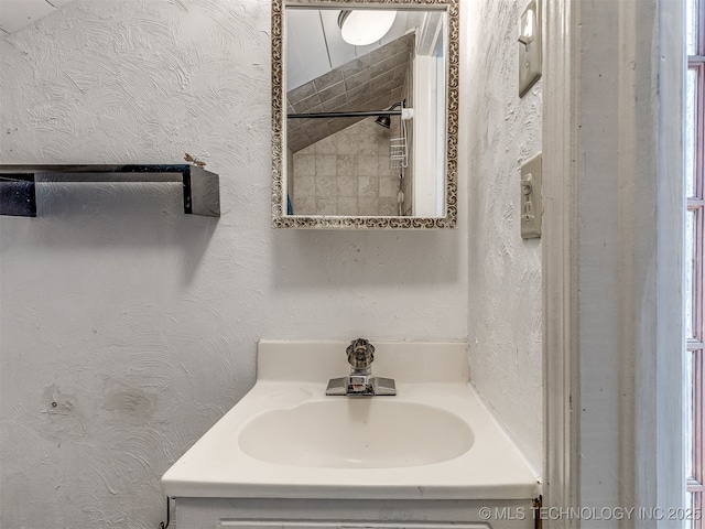 25206 E 64th St, Broken Arrow, OK 74012 - bathroom featuring vanity and a textured wall