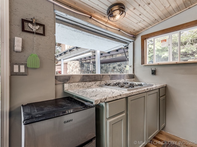 25206 E 64th St, Broken Arrow, OK 74012 - kitchen featuring lofted ceiling, gray cabinets, stainless steel gas cooktop, and wood finished floors