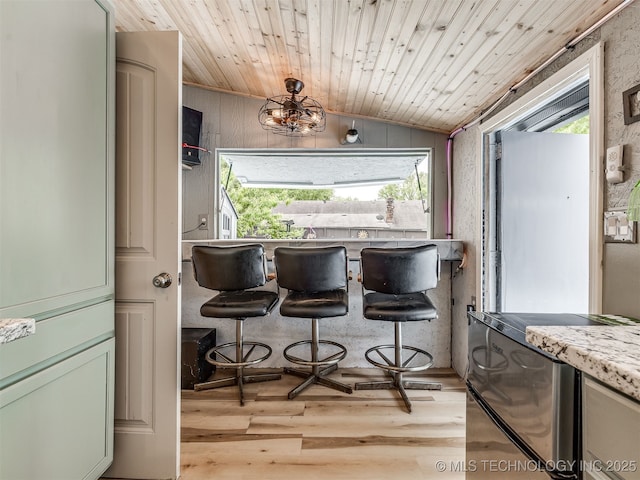 25206 E 64th St, Broken Arrow, OK 74012 - dining area featuring light wood-style flooring, vaulted ceiling, plenty of natural light, wooden ceiling, and a chandelier