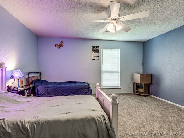 25206 E 64th St, Broken Arrow, OK 74012 - carpeted bedroom with a textured ceiling, a ceiling fan, a textured wall, and baseboards