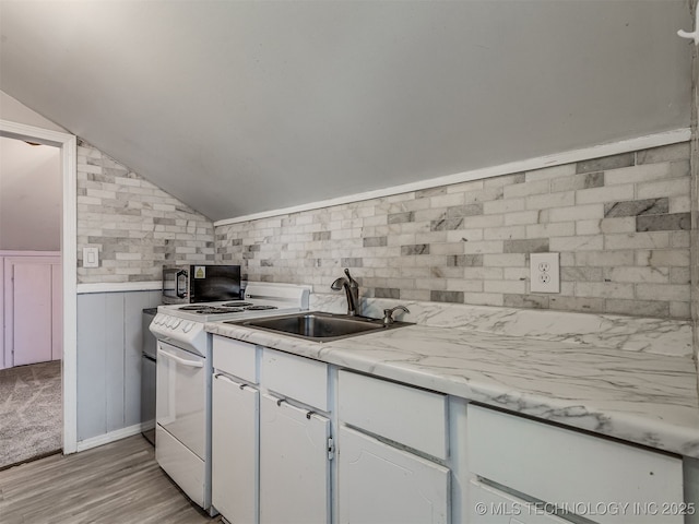 25206 E 64th St, Broken Arrow, OK 74012 - kitchen featuring black microwave, white electric range, a sink, vaulted ceiling, and light countertops