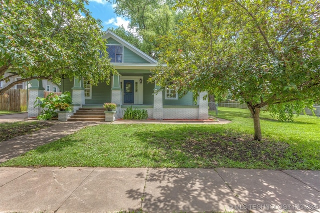 637 S Mounds St, Sapulpa, OK 74066 - view of front facade featuring brick siding and covered porch