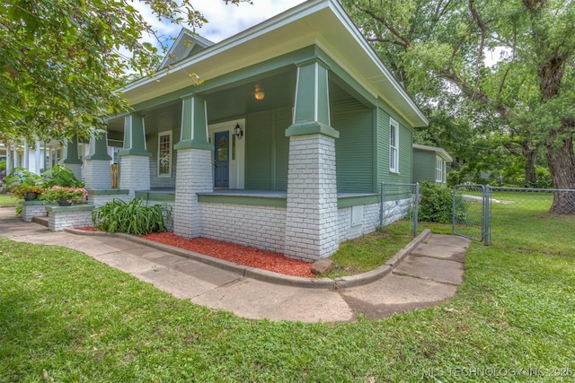 637 S Mounds St, Sapulpa, OK 74066 - view of front of property with a porch and brick siding
