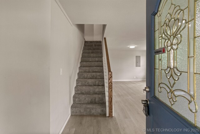 637 S Mounds St, Sapulpa, OK 74066 - entryway featuring wood finished floors, baseboards, stairs, and electric panel