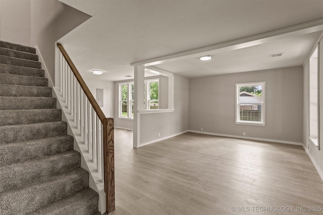 637 S Mounds St, Sapulpa, OK 74066 - unfurnished room with stairs, light wood-style floors, and baseboards