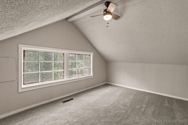 637 S Mounds St, Sapulpa, OK 74066 - additional living space featuring a textured ceiling, ceiling fan, lofted ceiling, carpet flooring, and wood walls