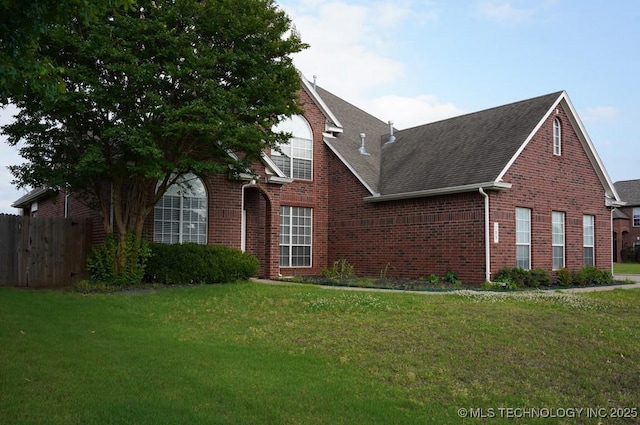703 N Butternut Ct, Broken Arrow, OK 74012 - view of property exterior with brick siding and roof with shingles