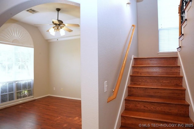 703 N Butternut Ct, Broken Arrow, OK 74012 - stairs featuring a ceiling fan, healthy amount of natural light, wood finished floors, arched walkways, and vaulted ceiling