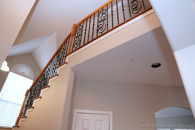 703 N Butternut Ct, Broken Arrow, OK 74012 - staircase with high vaulted ceiling