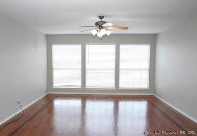 703 N Butternut Ct, Broken Arrow, OK 74012 - spare room featuring ceiling fan, baseboards, wood finished floors, and healthy amount of natural light
