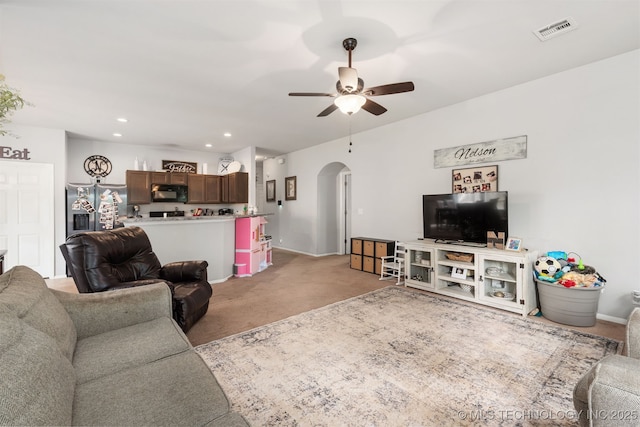 14867 S 281st E Ave, Coweta, OK 74429 - living area featuring arched walkways, light carpet, ceiling fan, recessed lighting, and baseboards