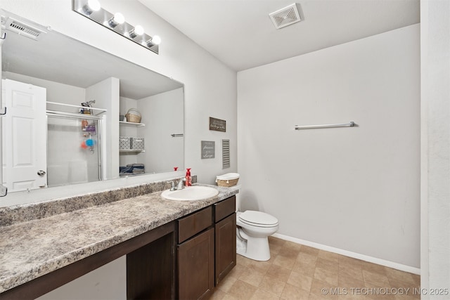 14867 S 281st E Ave, Coweta, OK 74429 - full bathroom featuring vanity, toilet, baseboards, and a stall shower