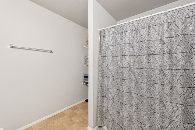 14867 S 281st E Ave, Coweta, OK 74429 - bathroom with a shower with curtain and baseboards