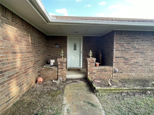 116 Cumberland, Ardmore, OK 73401 - doorway to property featuring brick siding