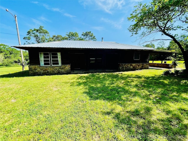 452038 E 965th Loop, Vian, OK 74962 - view of front of property featuring stone siding, a front lawn, and metal roof