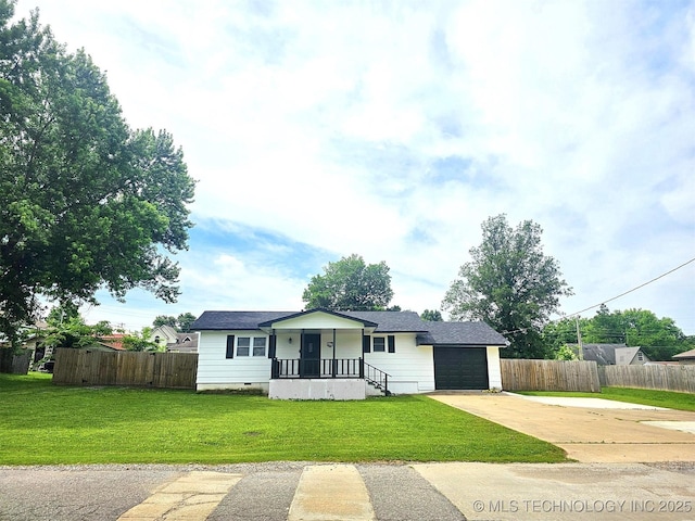 1306 E Shawnee St, Tahlequah, OK 74464 - view of front of house with covered porch, concrete driveway, an attached garage, and crawl space
