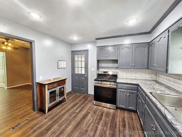 1306 E Shawnee St, Tahlequah, OK 74464 - kitchen with stainless steel gas stove, gray cabinets, dark wood-type flooring, and recessed lighting