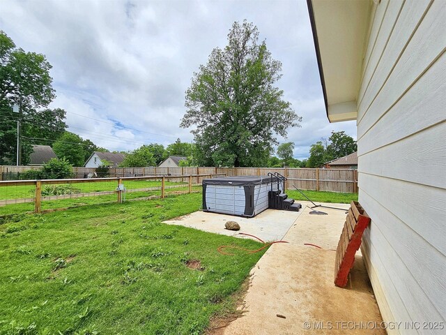 1306 E Shawnee St, Tahlequah, OK 74464 - fenced backyard with a hot tub and a patio