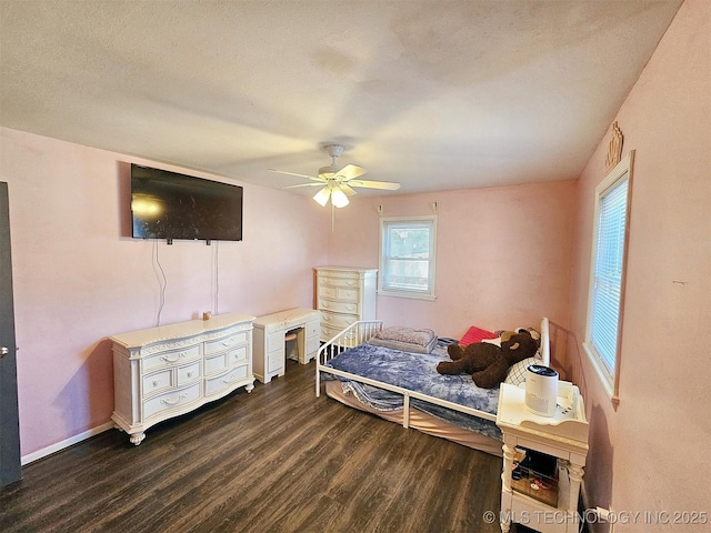 1306 E Shawnee St, Tahlequah, OK 74464 - bedroom with dark wood-style floors and ceiling fan