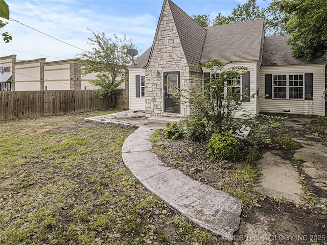 148 W 4th, Atoka, OK 74525 - view of front of property with roof with shingles and stone siding
