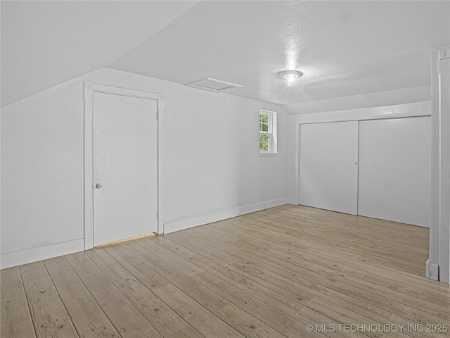 148 W 4th, Atoka, OK 74525 - additional living space with hardwood / wood-style flooring and lofted ceiling