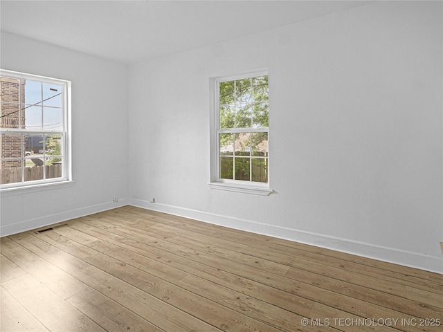 148 W 4th, Atoka, OK 74525 - unfurnished room with wood-type flooring and baseboards