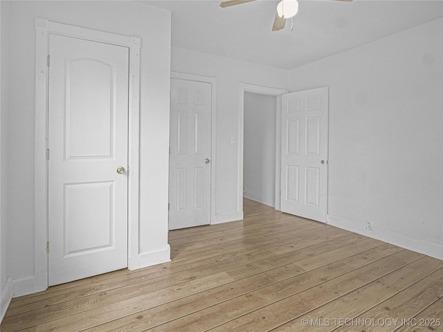 148 W 4th, Atoka, OK 74525 - unfurnished bedroom with light wood-type flooring, baseboards, and a ceiling fan