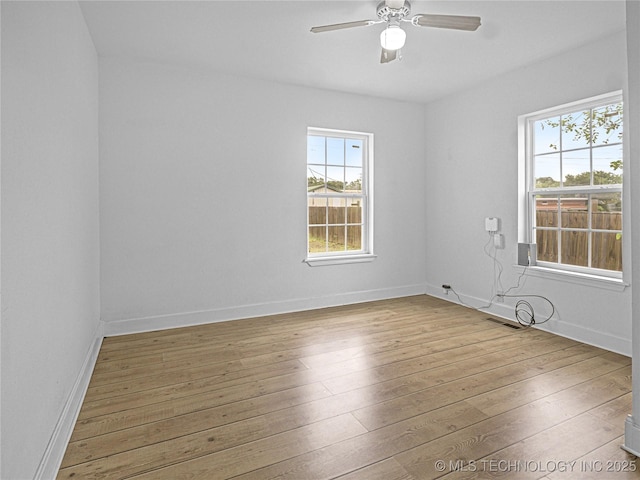 148 W 4th, Atoka, OK 74525 - spare room with wood-type flooring, ceiling fan, and baseboards