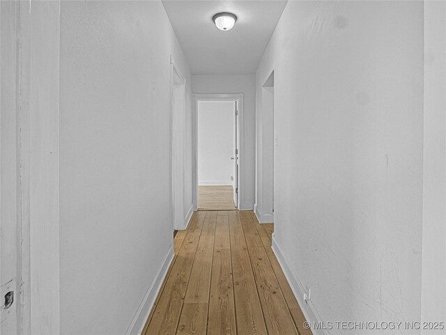 148 W 4th, Atoka, OK 74525 - hall featuring light wood-style flooring and baseboards