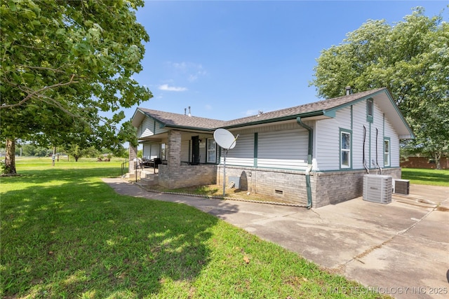 15291 S 4187th Rd, Claremore, OK 74017 - view of front facade with a front yard, a porch, brick siding, and central AC