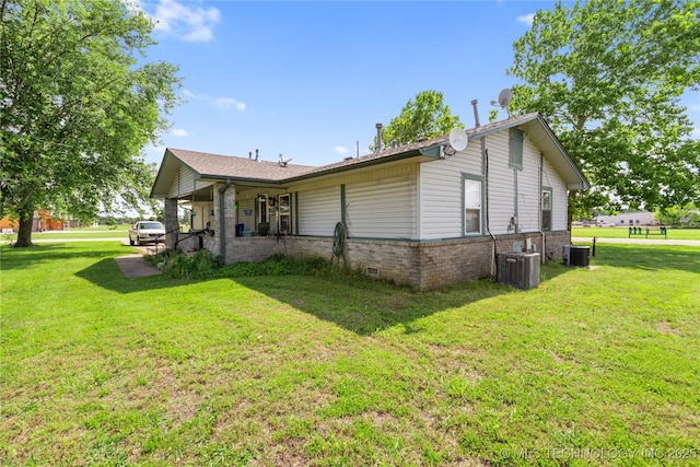 15291 S 4187th Rd, Claremore, OK 74017 - view of side of property featuring a lawn, central AC unit, and brick siding