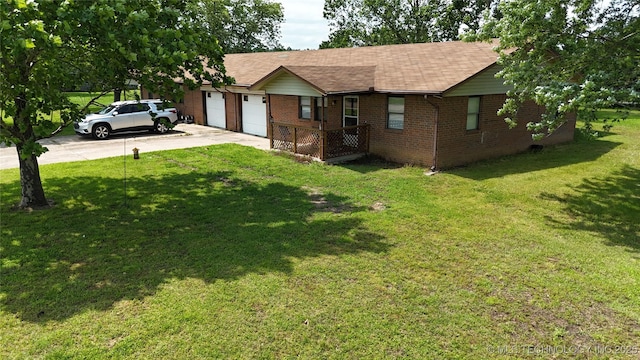 15291 S 4187th Rd, Claremore, OK 74017 - view of front of home featuring brick siding, driveway, an attached garage, and a front lawn
