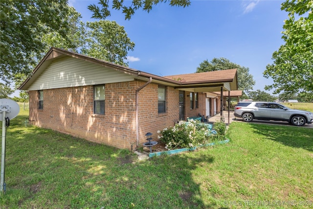 15291 S 4187th Rd, Claremore, OK 74017 - view of property exterior featuring a yard and brick siding