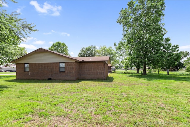 15291 S 4187th Rd, Claremore, OK 74017 - view of side of home with brick siding and a lawn