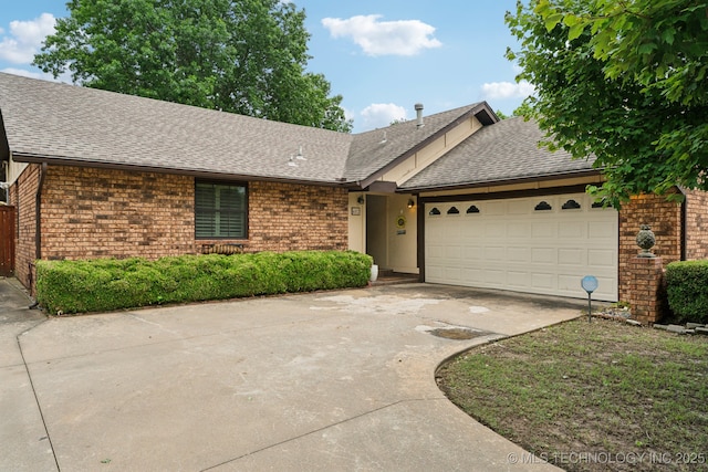 single story home with brick siding, concrete driveway, and a shingled roof